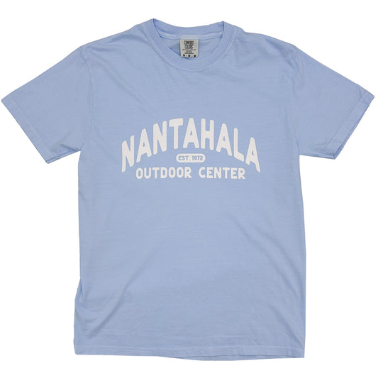A light blue short-sleeve t-shirt with 'NANTAHALA OUTDOOR CENTER EST. 1972' printed in white on the front, displayed flat against a blue background.